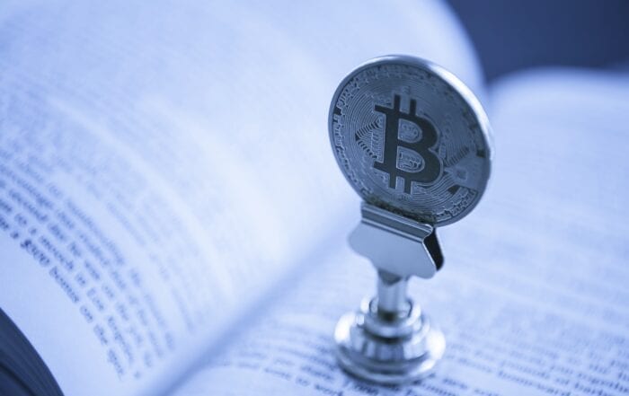 bitcoin in the middle of a book
