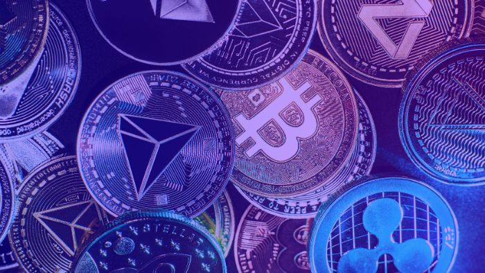 A colourful close-up of various cryptocurrency coins, including Bitcoin, Ethereum, TRON, Ripple, and others, symbolising the diversity and innovation in the digital asset market.